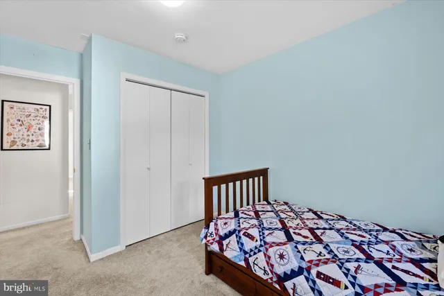 a bedroom with a bed and closet