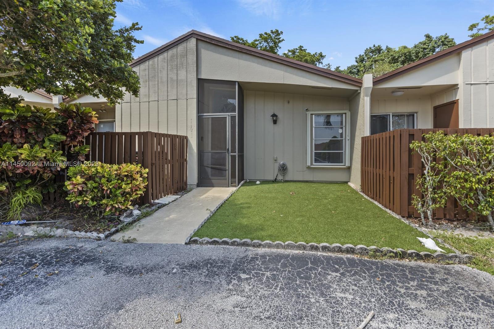 11671 Timbers Way Boca Raton, FL 33428 - Photo 1 of 25 a view of a house with a yard
