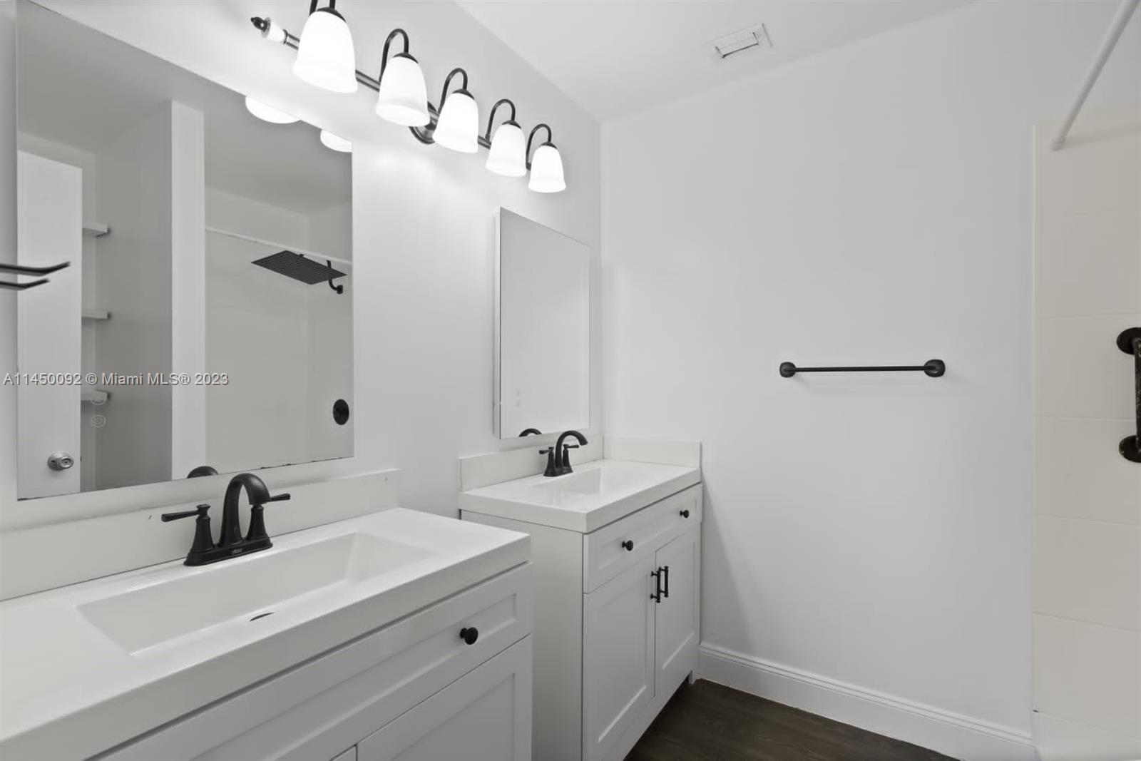 11671 Timbers Way Boca Raton, FL 33428 - Photo 11 of 25 a bathroom with a sink and a mirror