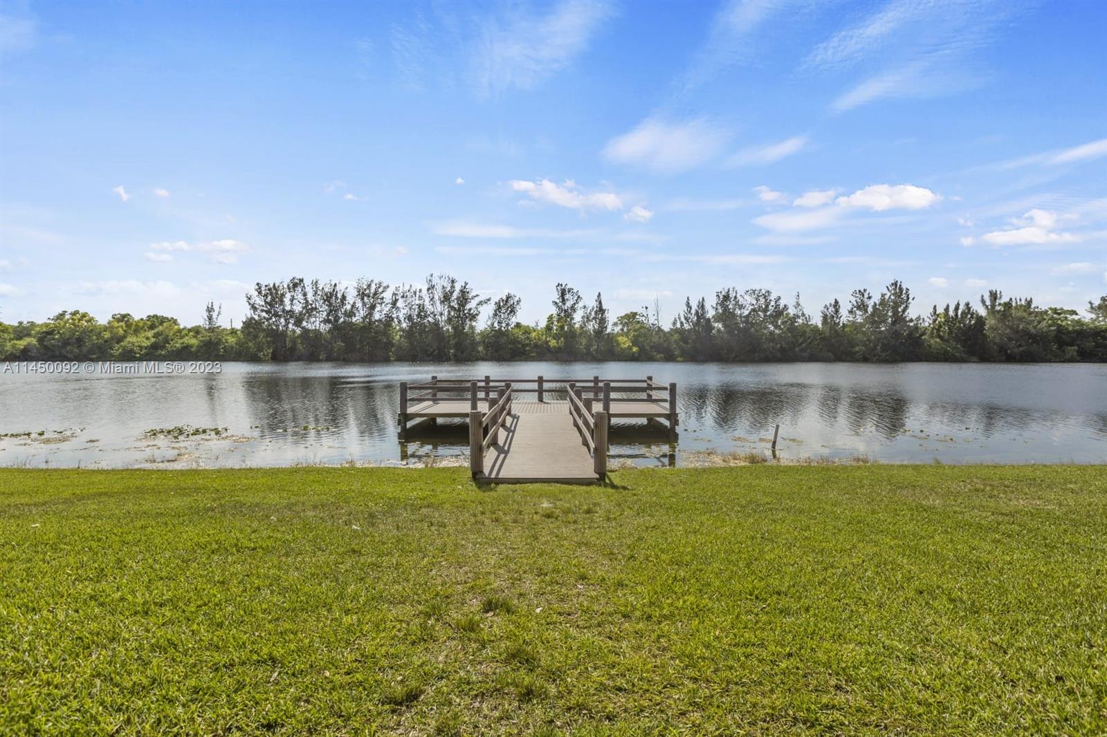 11671 Timbers Way Boca Raton, FL 33428 - Photo 21 of 25 a view of a lake with houses in the back