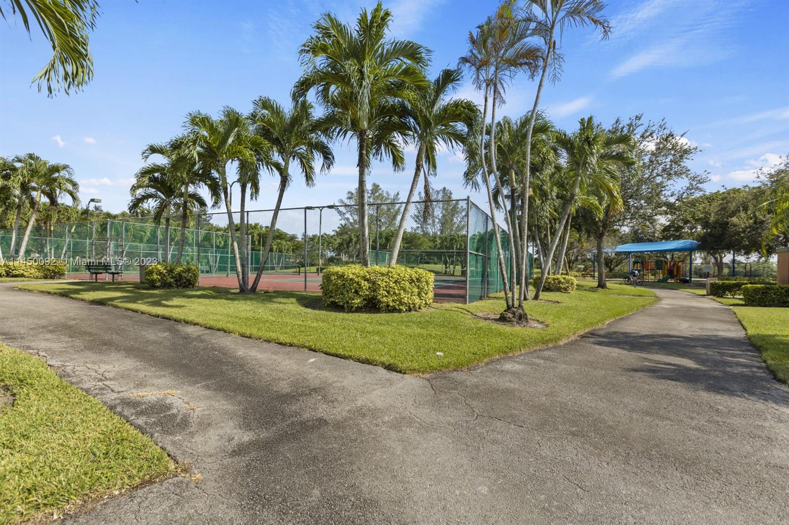 11671 Timbers Way Boca Raton, FL 33428 - Photo 23 of 25 a garden view with palm trees