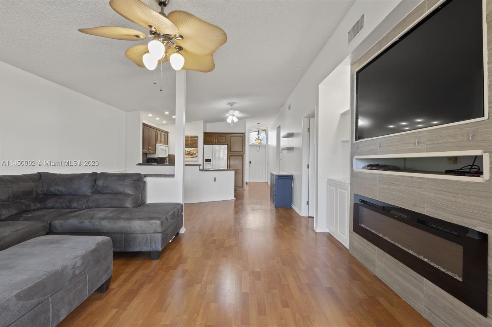 11671 Timbers Way Boca Raton, FL 33428 - Photo 3 of 25 a living room with furniture and a flat screen tv