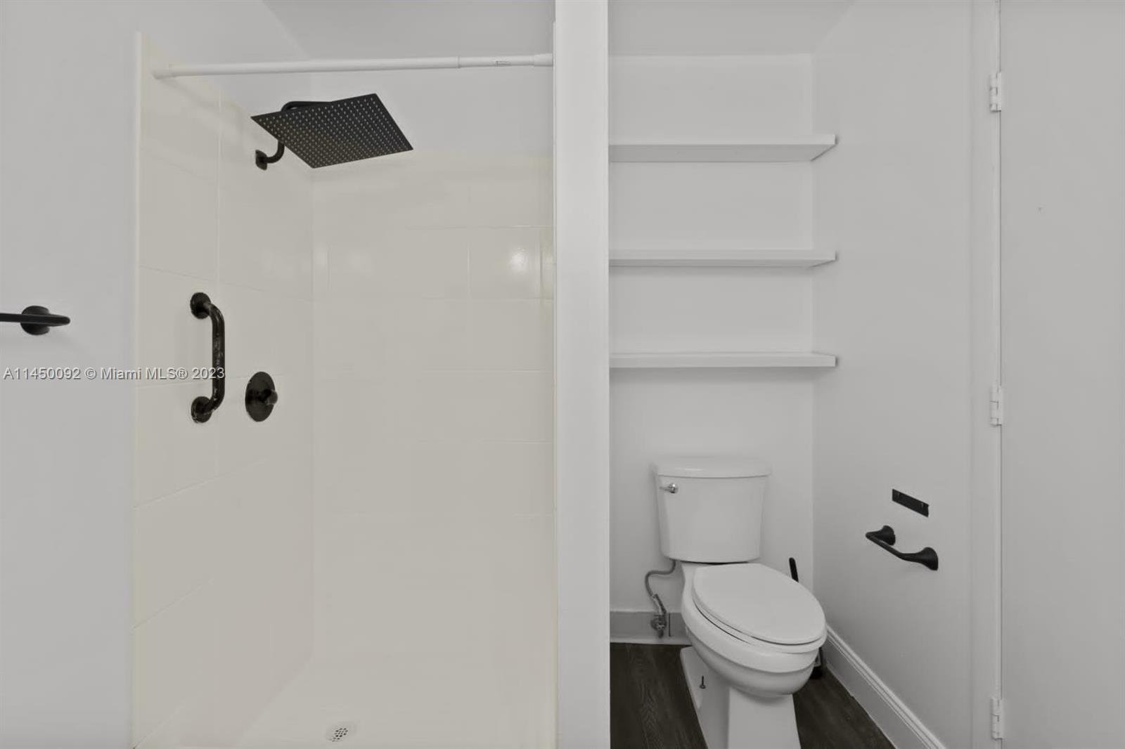 11671 Timbers Way Boca Raton, FL 33428 - Photo 9 of 25 a bathroom with a toilet and a shower