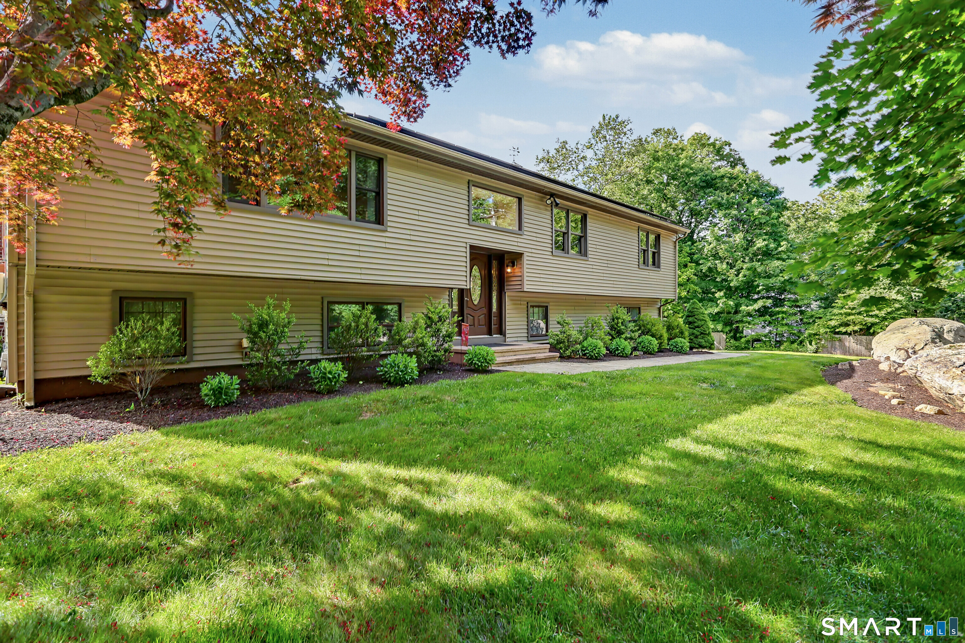 632 Wheelers Farm Road Orange, CT 06477 - Photo 39 of 39 a view of a house with a yard and sitting area