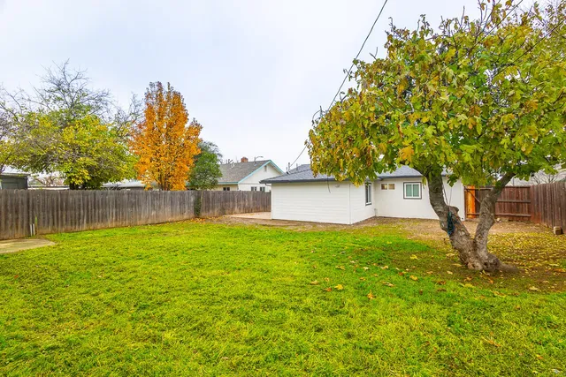 a backyard of a house with lots of green space