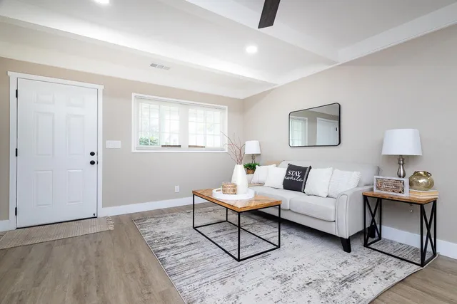a living room with furniture and a window