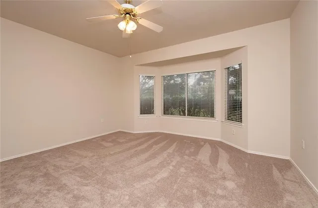 a spacious bathroom with a double vanity sink a mirror and a shower