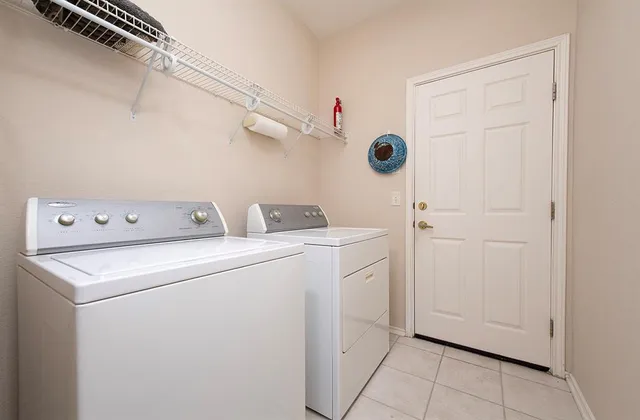 a view of a house with a yard and front view of a house