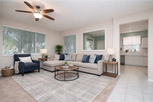 a kitchen with a refrigerator a sink and a stove top oven