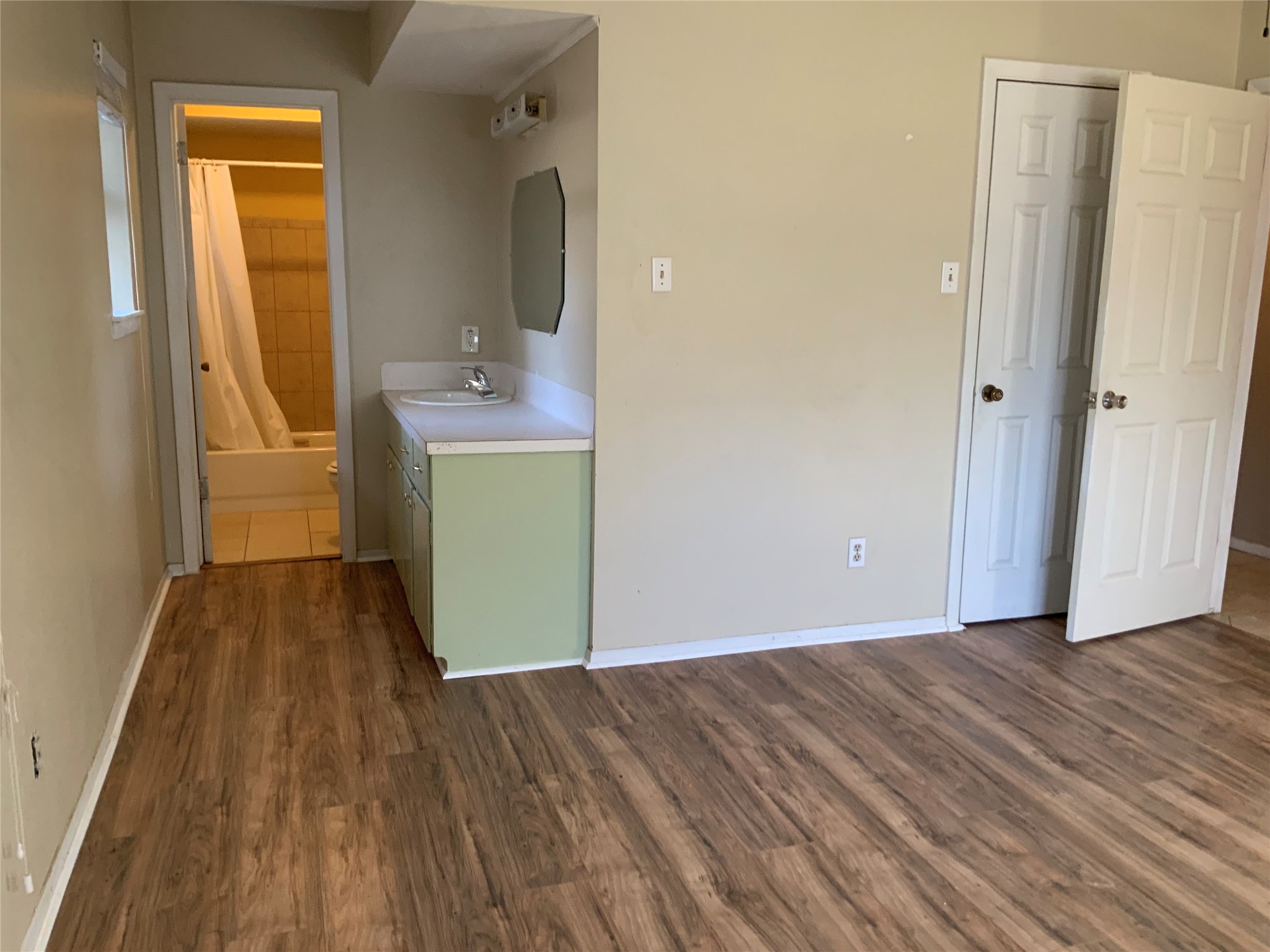 301 Travis Street Baytown, TX 77520 - Photo 25 of 37 Primary Bedroom 3 looking into bathroom