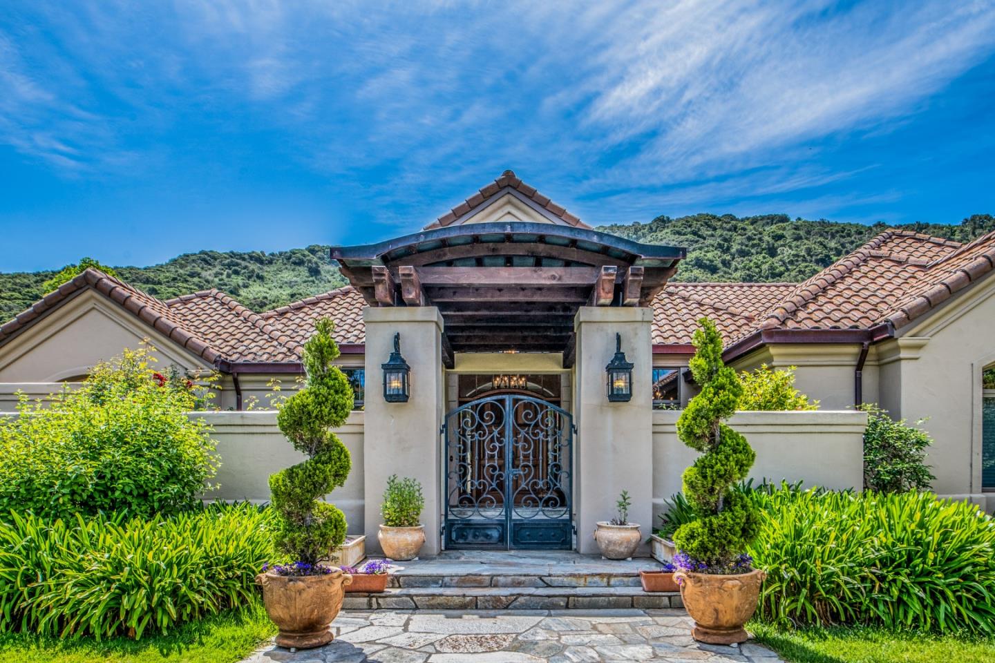 a front view of a house with garden