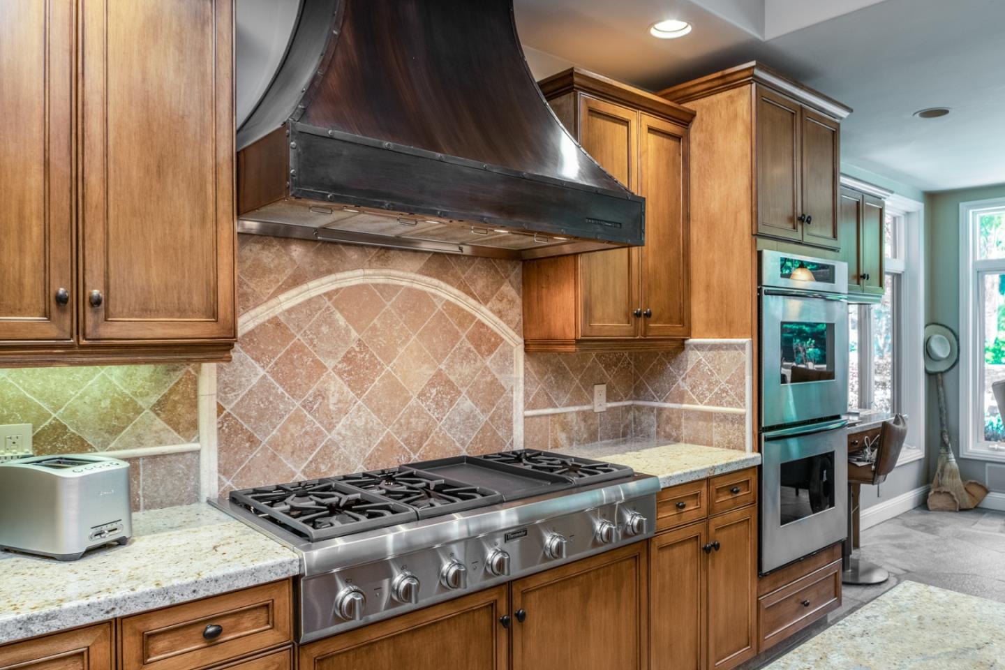 8630 River Meadows Road Carmel, CA 93923 - Photo 12 of 50 a kitchen with granite countertop a stove and a sink