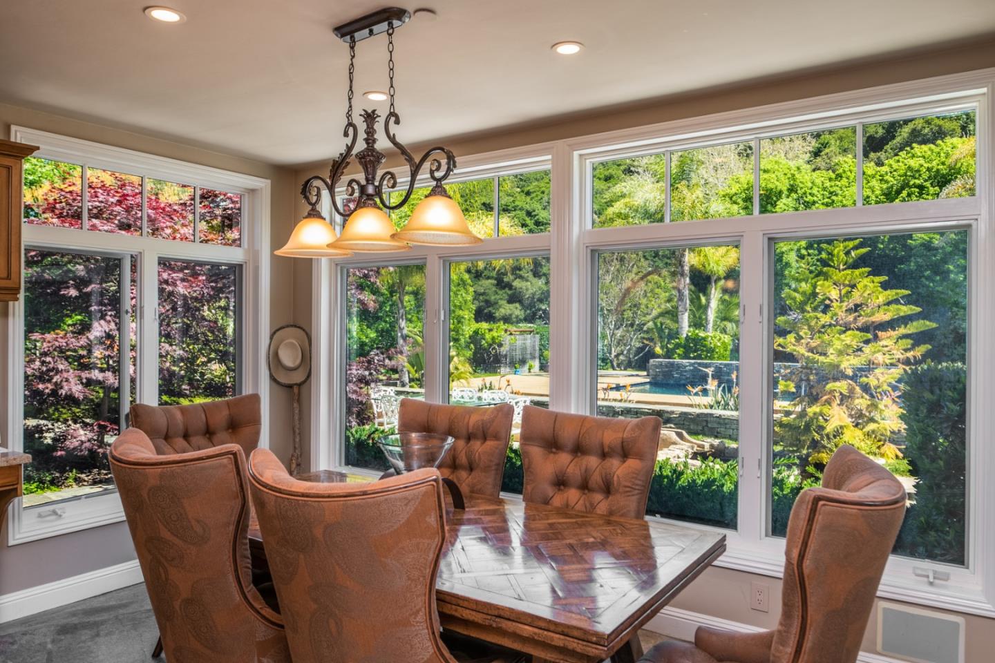 8630 River Meadows Road Carmel, CA 93923 - Photo 13 of 50 a dining room with furniture garden view and a chandelier