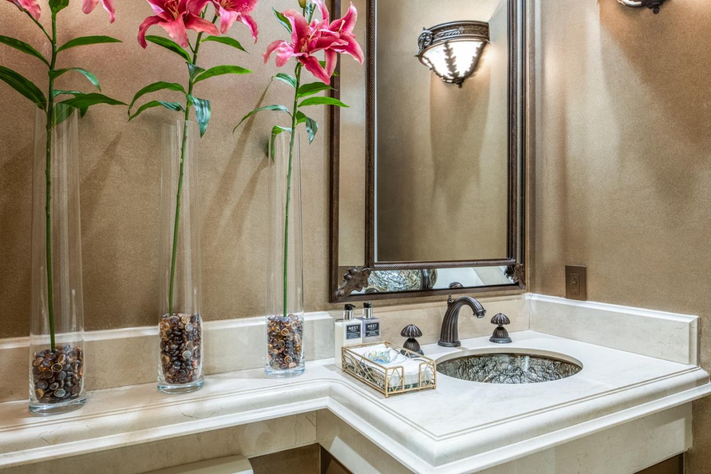 8630 River Meadows Road Carmel, CA 93923 - Photo 16 of 50 a bathroom with a sink and a mirror