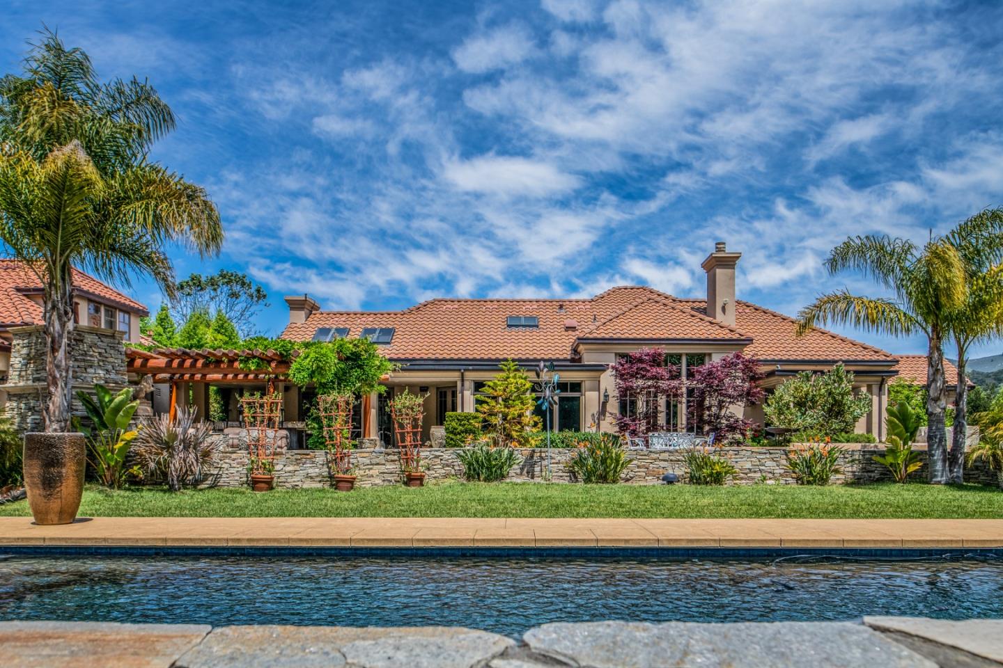 8630 River Meadows Road Carmel, CA 93923 - Photo 2 of 50 a front view of a house with a yard
