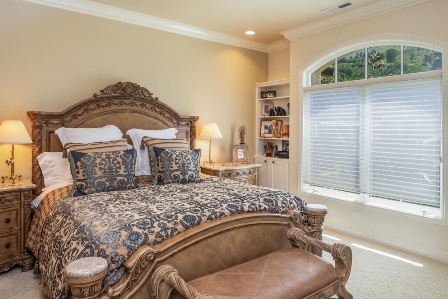 8630 River Meadows Road Carmel, CA 93923 - Photo 23 of 50 a bed sitting in a bedroom next to a window and a chair