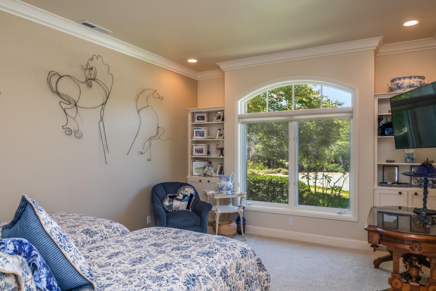 8630 River Meadows Road Carmel, CA 93923 - Photo 25 of 50 a bedroom with a bed and a large window