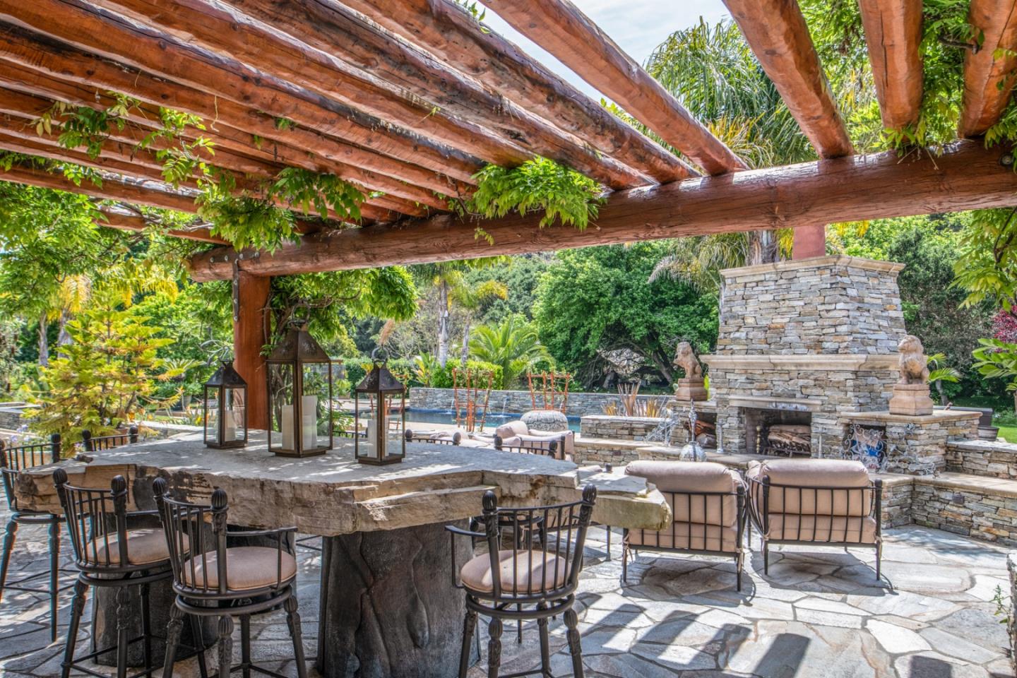 8630 River Meadows Road Carmel, CA 93923 - Photo 29 of 50 a view of an outdoor space with a table and chairs