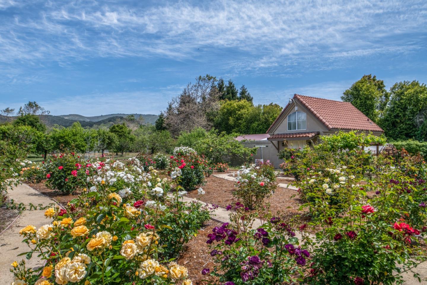 8630 River Meadows Road Carmel, CA 93923 - Photo 46 of 50 a view of a house with a yard and garden