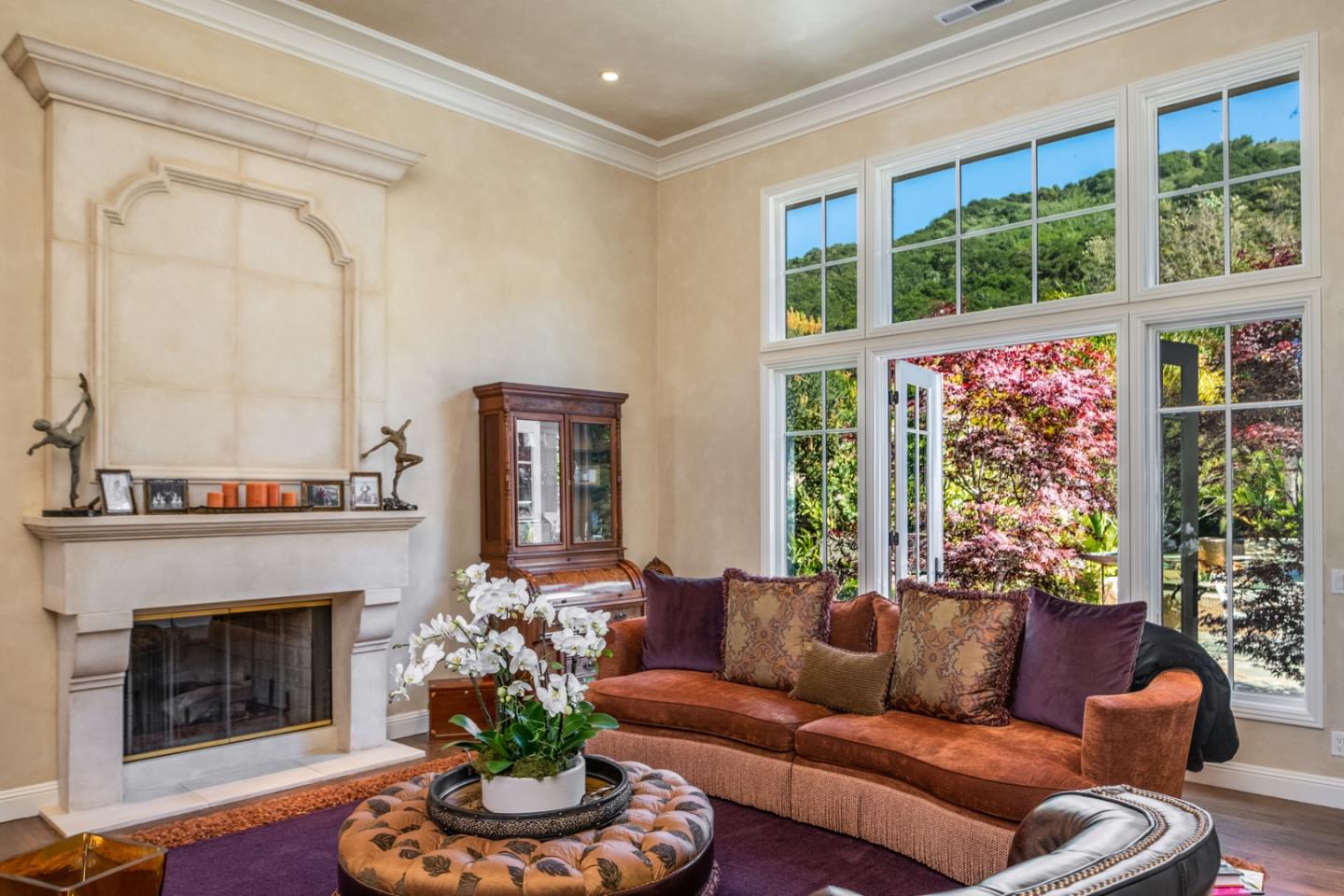 8630 River Meadows Road Carmel, CA 93923 - Photo 7 of 50 a living room with furniture a fireplace and a large window