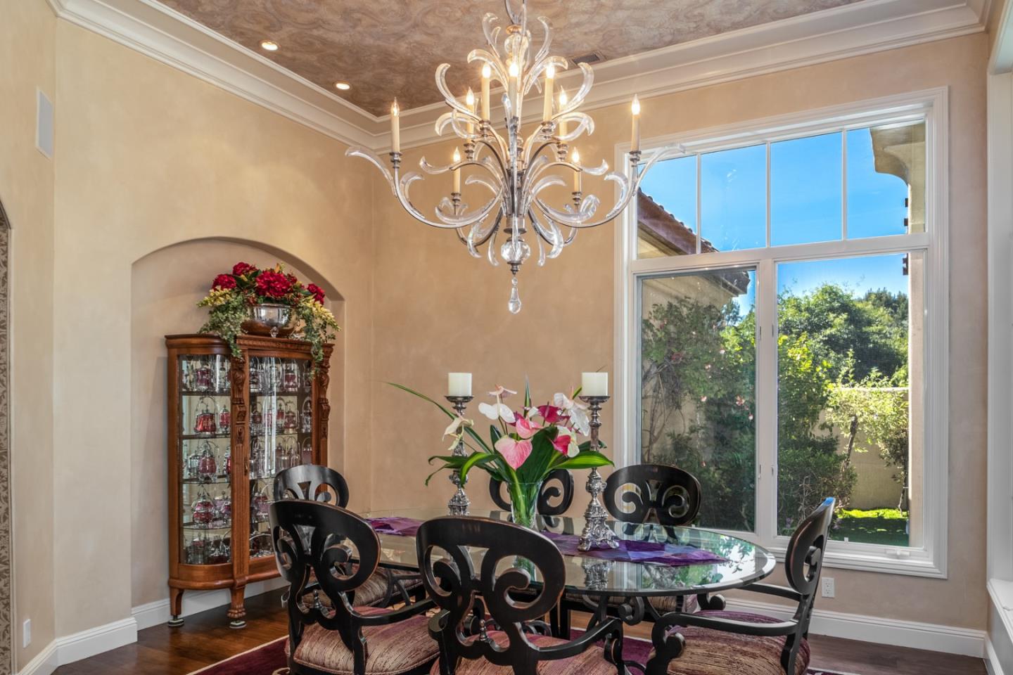 8630 River Meadows Road Carmel, CA 93923 - Photo 8 of 50 a view of a dining room with furniture wooden floor and a chandelier