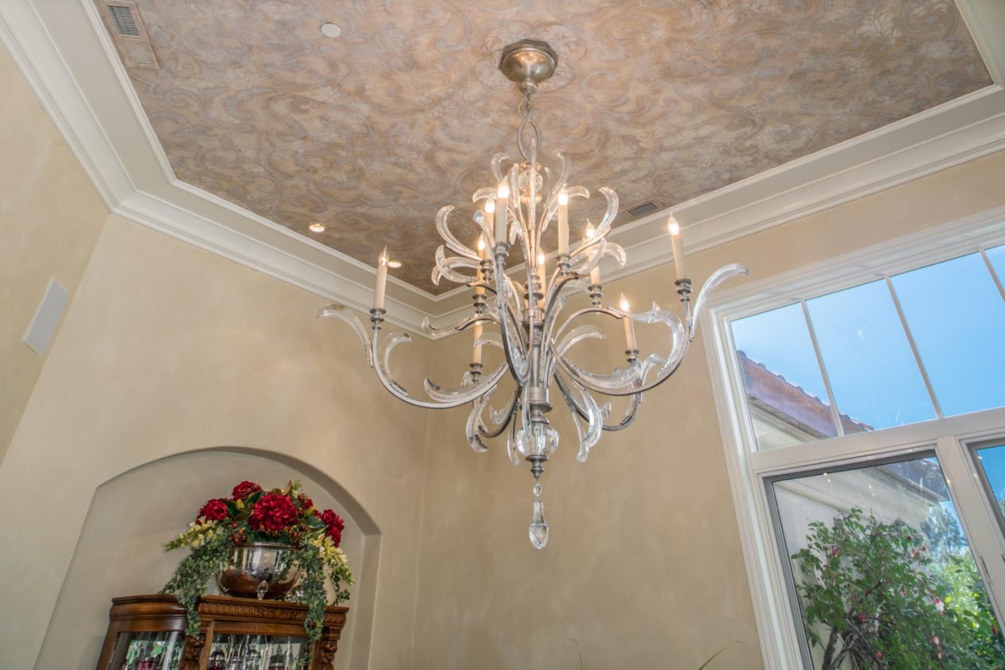 8630 River Meadows Road Carmel, CA 93923 - Photo 9 of 50 a vase of flowers sitting on a table in a window