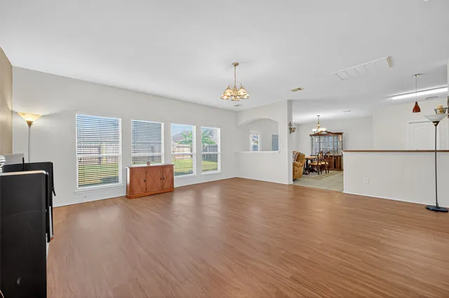 a view of livingroom with furniture wooden floor and windows