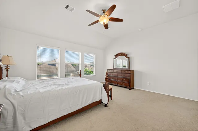 a bedroom with a bed and window