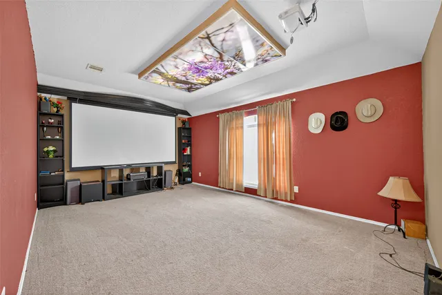 a view of an empty room with a flat screen tv