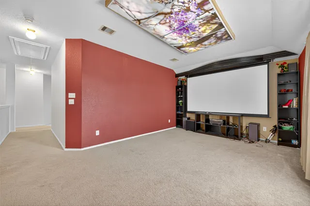 a view of an empty room with a flat screen tv