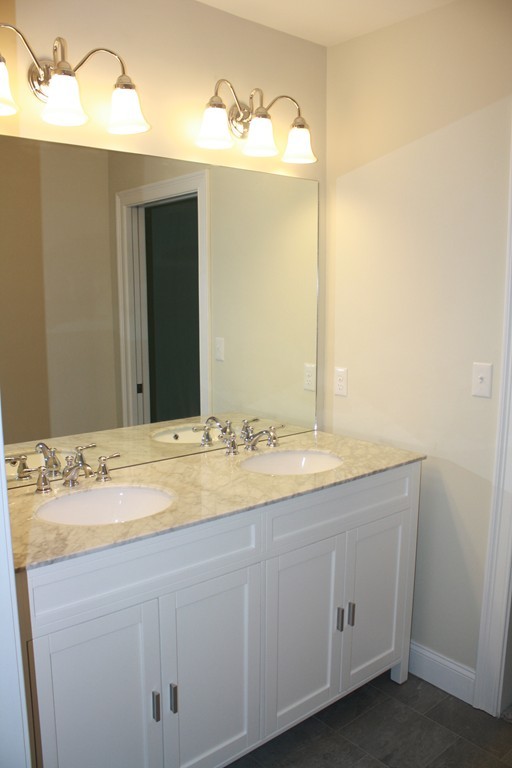 4 Maynard Road Sudbury, MA 01776 - Photo 13 of 22 a bathroom with a sink and a mirror
