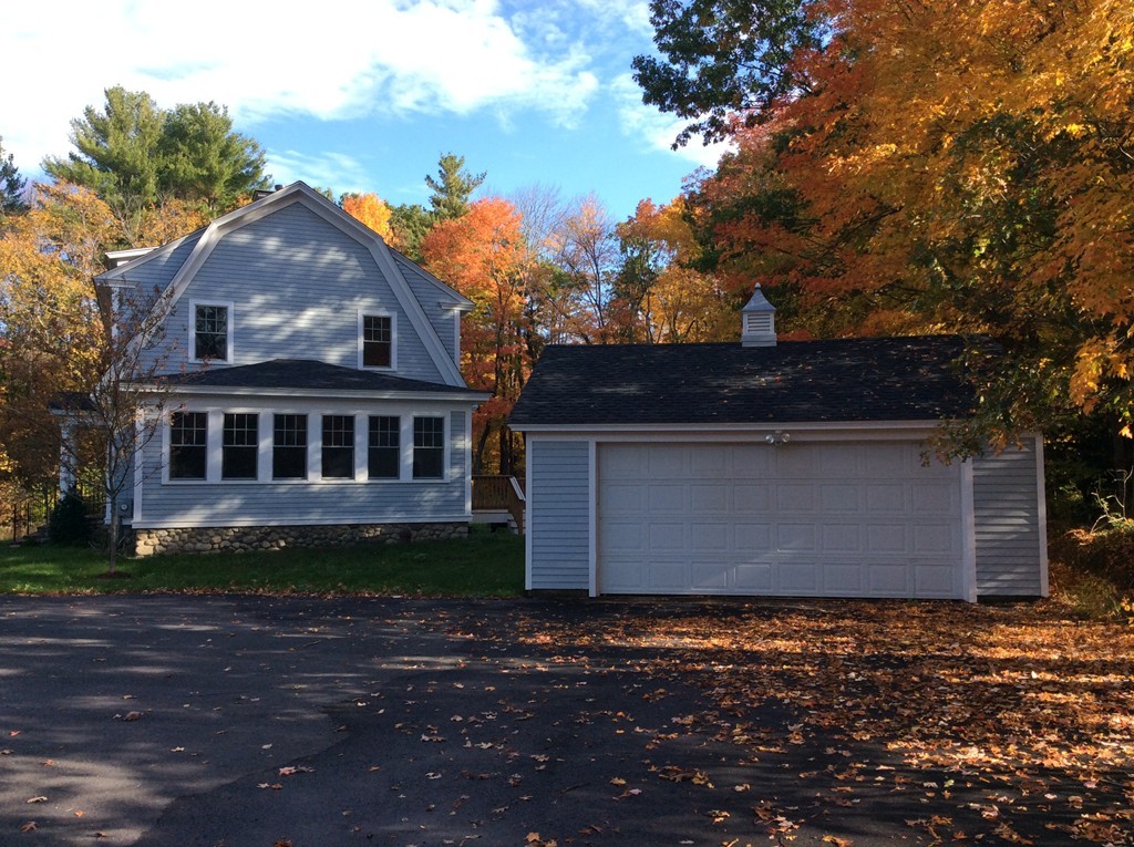 4 Maynard Road Sudbury, MA 01776 - Photo 19 of 22 a front view of a house with a yard