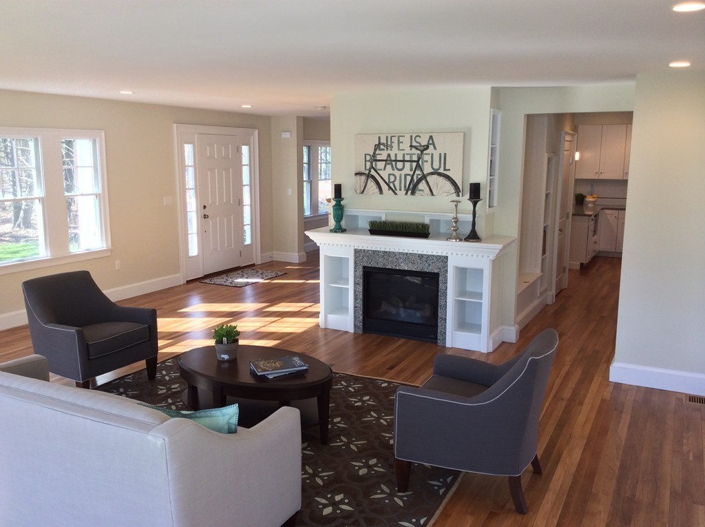 4 Maynard Road Sudbury, MA 01776 - Photo 2 of 22 a living room with furniture and a fireplace