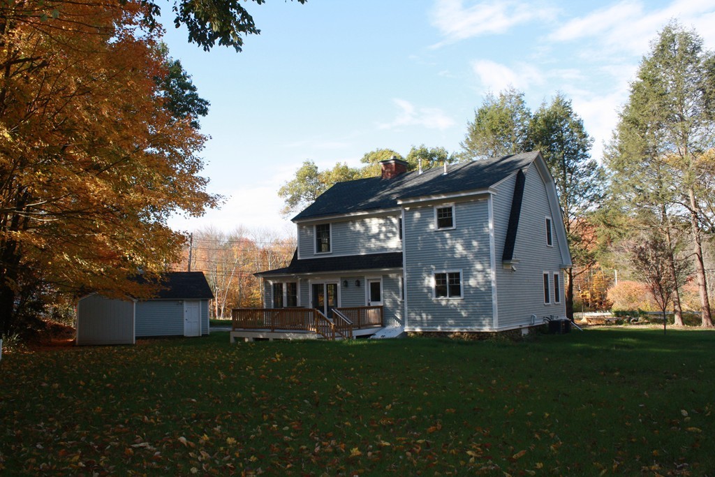 4 Maynard Road Sudbury, MA 01776 - Photo 21 of 22 a front view of a house with garden