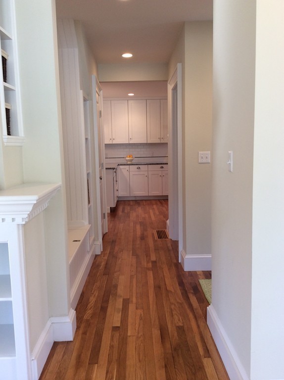 4 Maynard Road Sudbury, MA 01776 - Photo 5 of 22 a view of a hallway with wooden floor