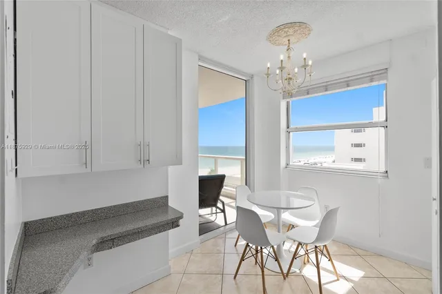 a kitchen with a sink and a stove top oven