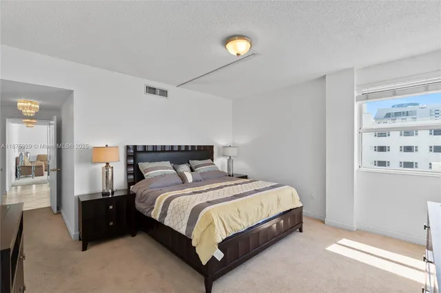 a bathroom with a shower sink and mirror
