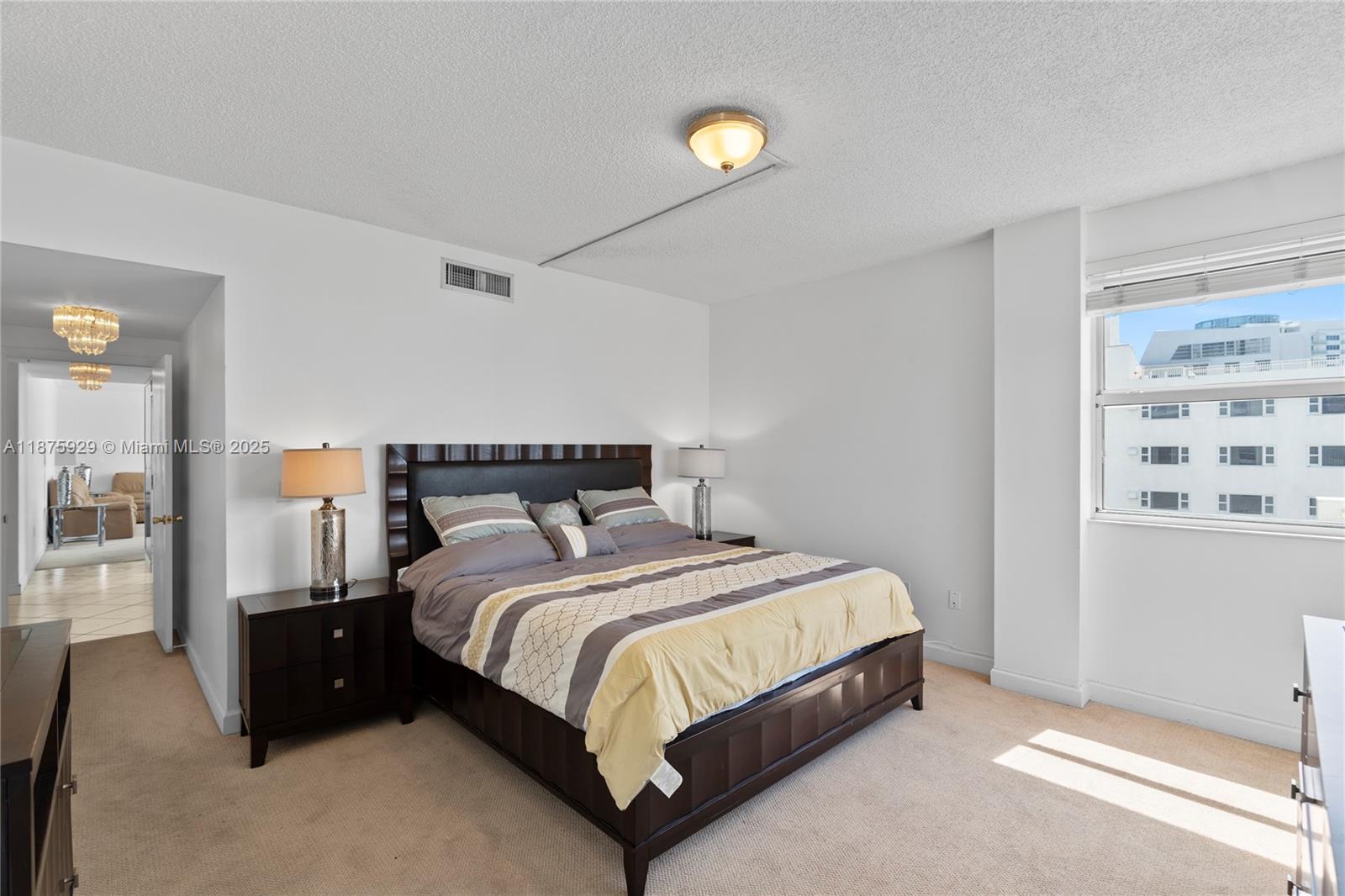 4201 Collins Avenue, Unit 701 Miami Beach, FL 33140 - Photo 23 of 61 a bedroom with a bed and closet