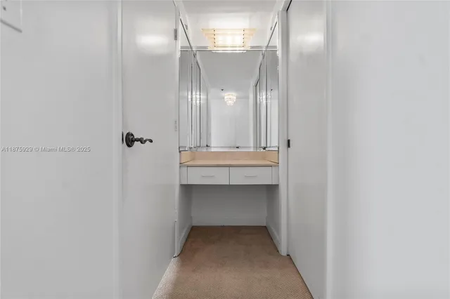 a bathroom with a tub a sink and mirror