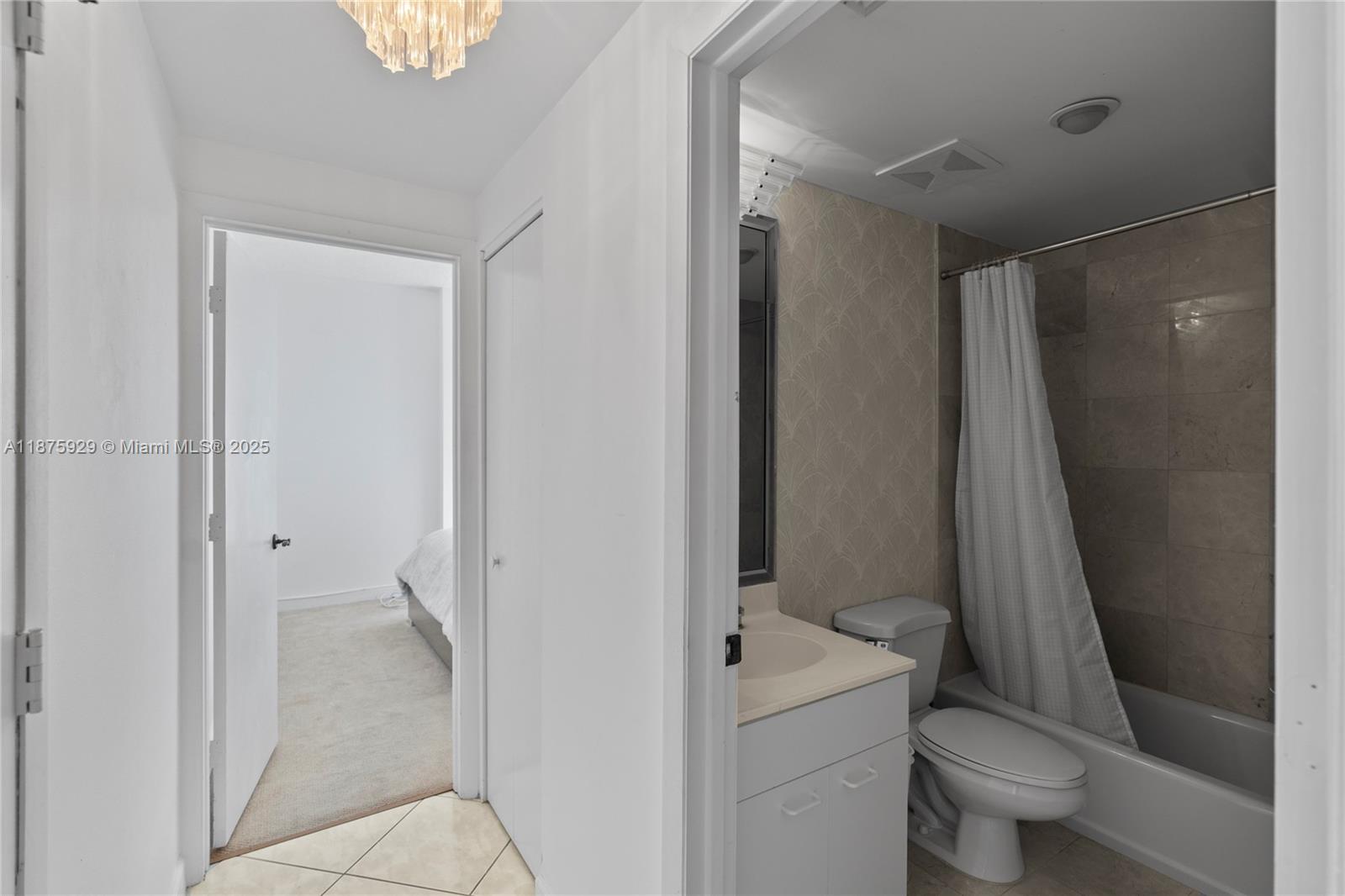 4201 Collins Avenue, Unit 701 Miami Beach, FL 33140 - Photo 30 of 61 a bathroom with a granite countertop sink toilet and shower