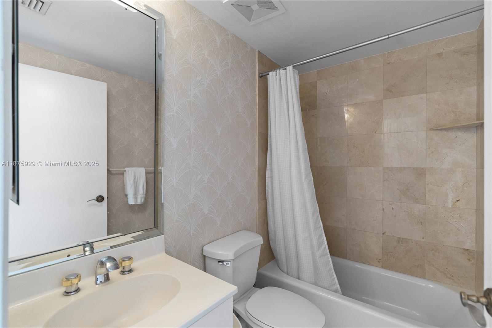 4201 Collins Avenue, Unit 701 Miami Beach, FL 33140 - Photo 31 of 61 a bathroom with a sink toilet and shower