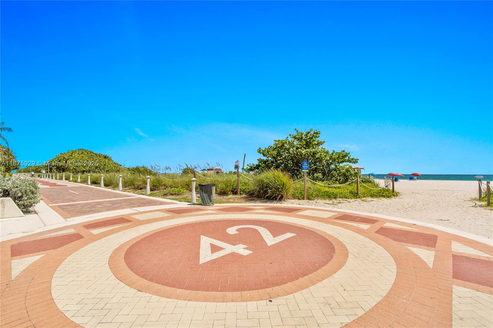 4201 Collins Avenue, Unit 701 Miami Beach, FL 33140 - Photo 61 of 61 a view of a swimming pool with an ocean in the background