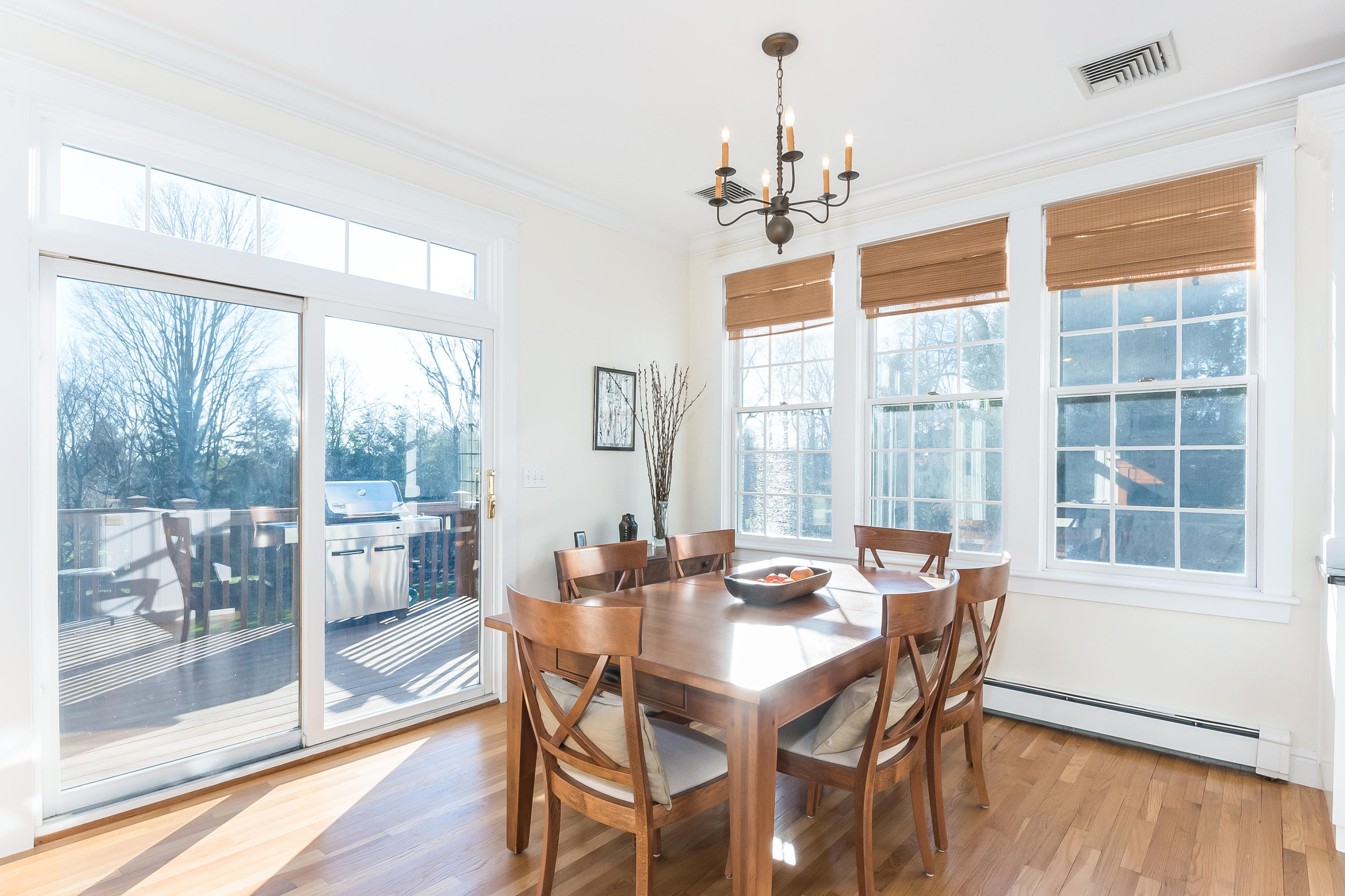 26 Stanton Road Darien, CT 06820 - Photo 14 of 40 a view of a dining room with furniture large windows and wooden floor