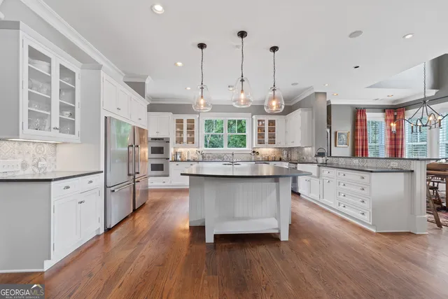 a view of a backyard with large trees