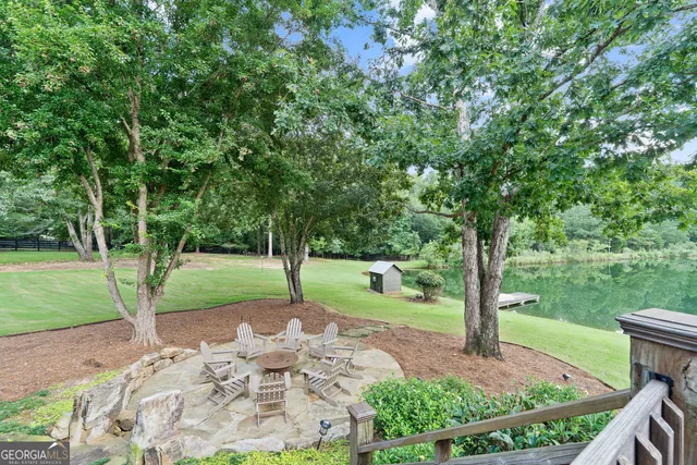a spacious bathroom with a double vanity sink mirror and shower