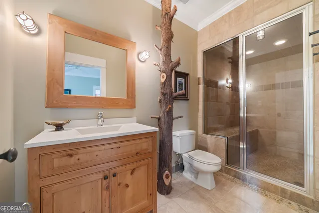 a bed room with a bed and a chandelier