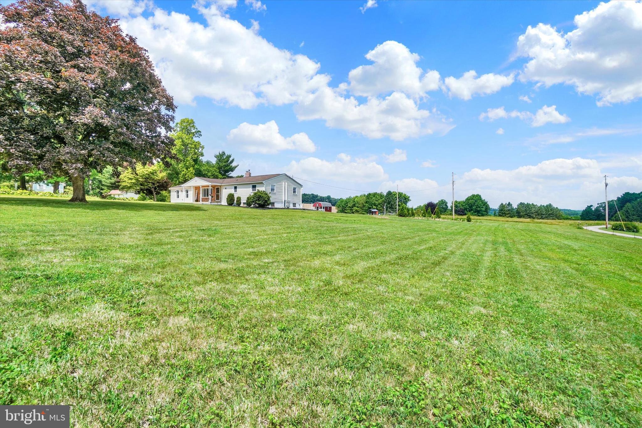 13174 Mont Road Felton, PA 17322 - Photo 6 of 39 a backyard of a house with lots of green space