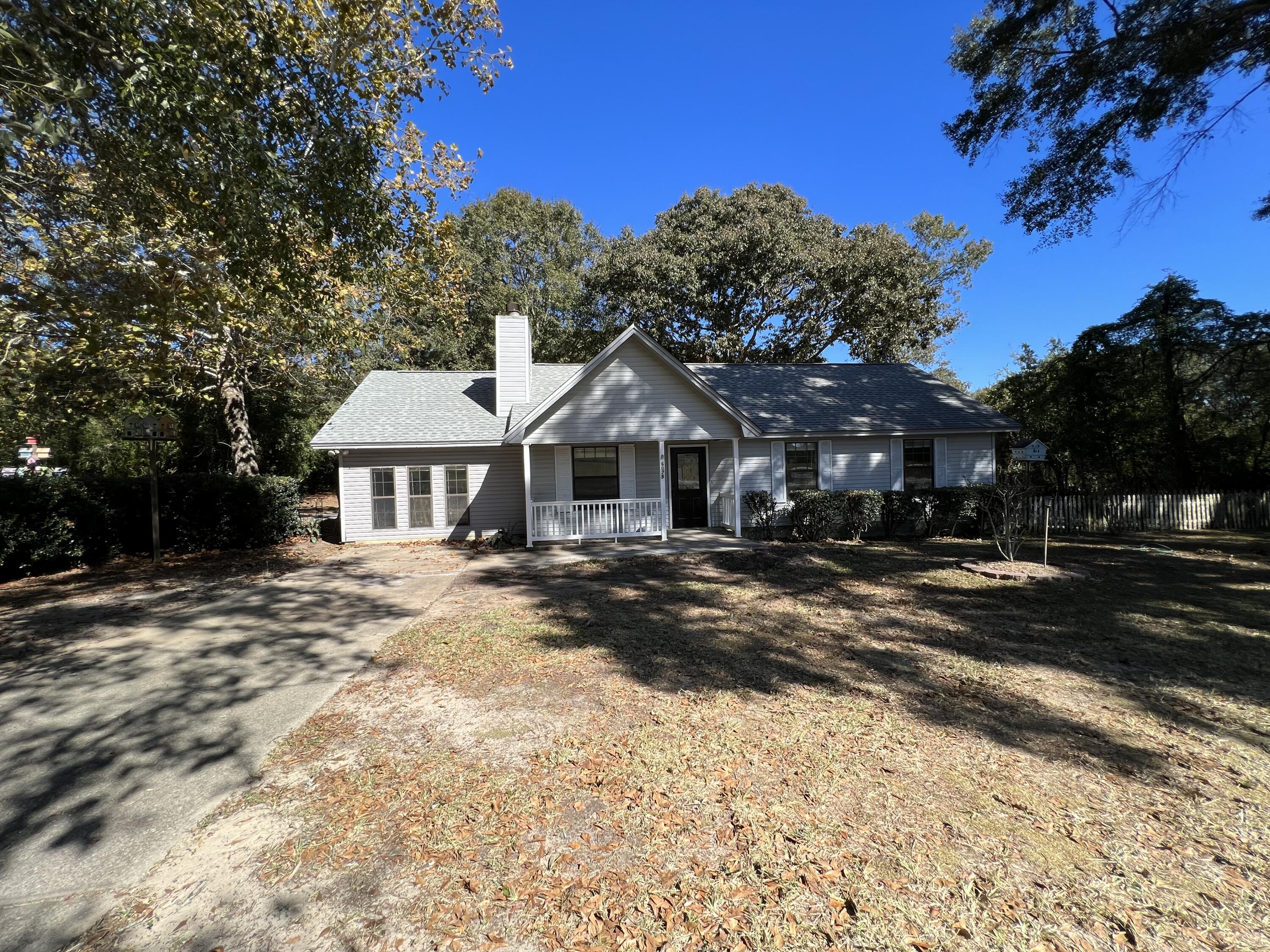 6028 Old Bethel Road Crestview, FL 32536 - Photo 1 of 16 a front view of a house with a yard
