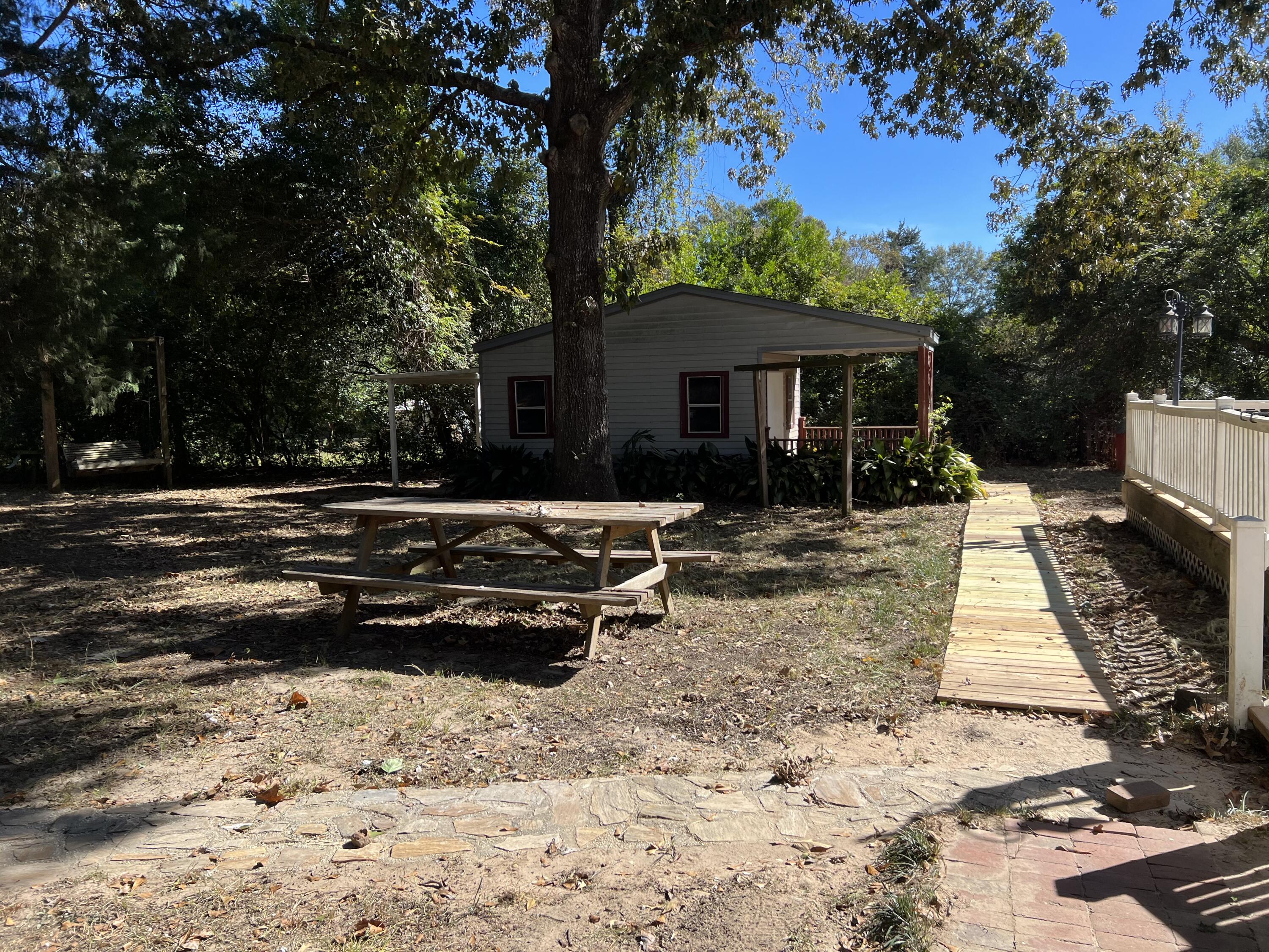 6028 Old Bethel Road Crestview, FL 32536 - Photo 13 of 16 a front view of a house with a yard