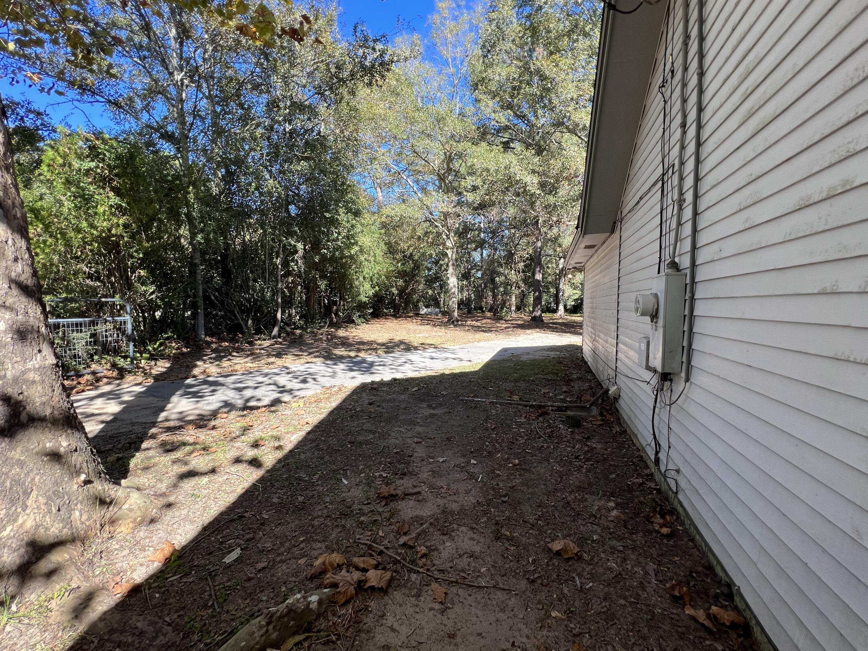 6028 Old Bethel Road Crestview, FL 32536 - Photo 16 of 16 a view of a backyard with large trees